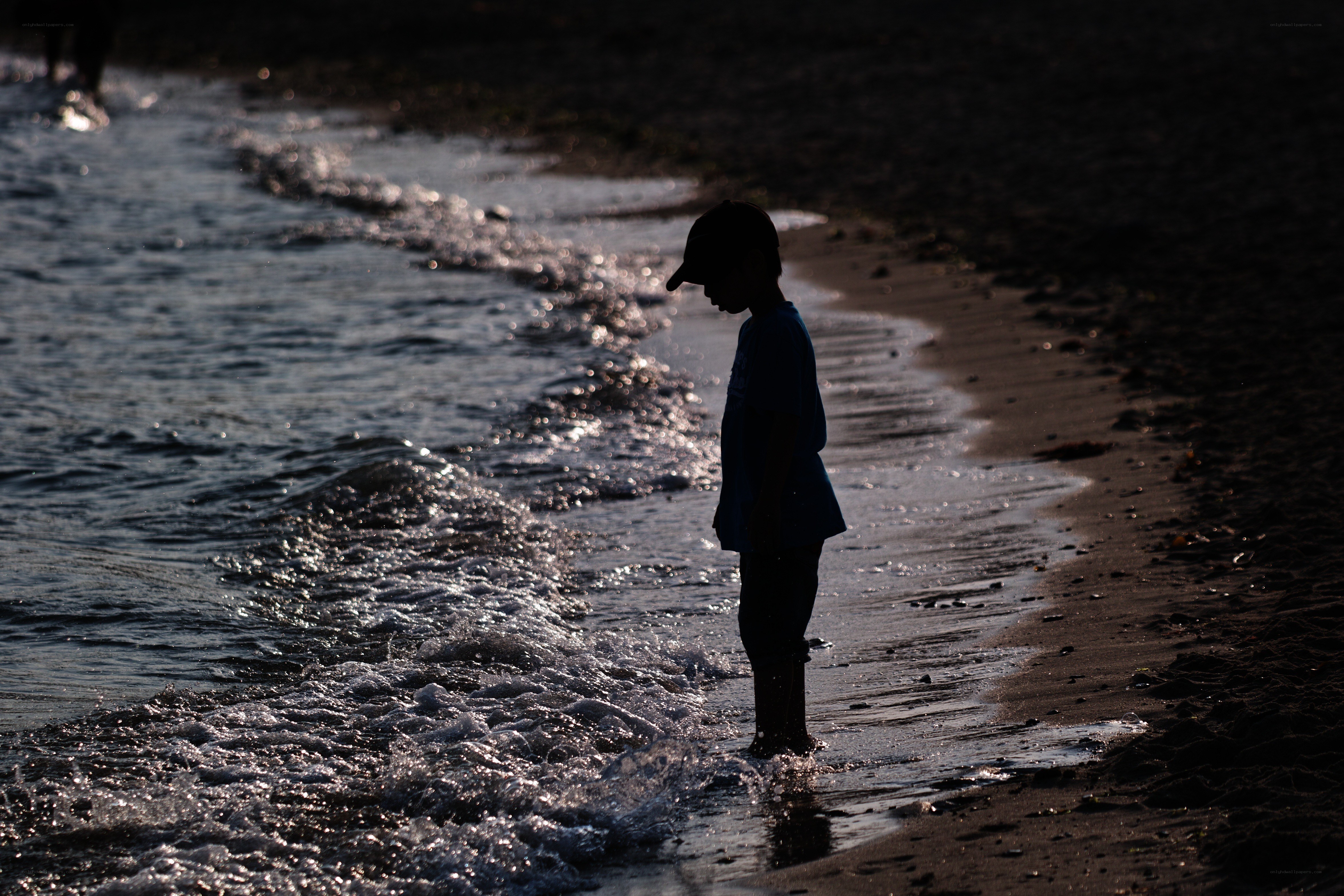 Child at the water's edge