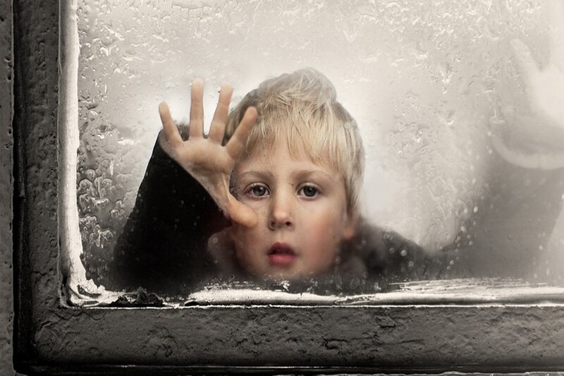 Child at Wet Window