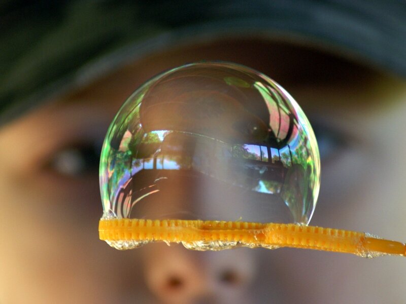 Child blowing a bubble