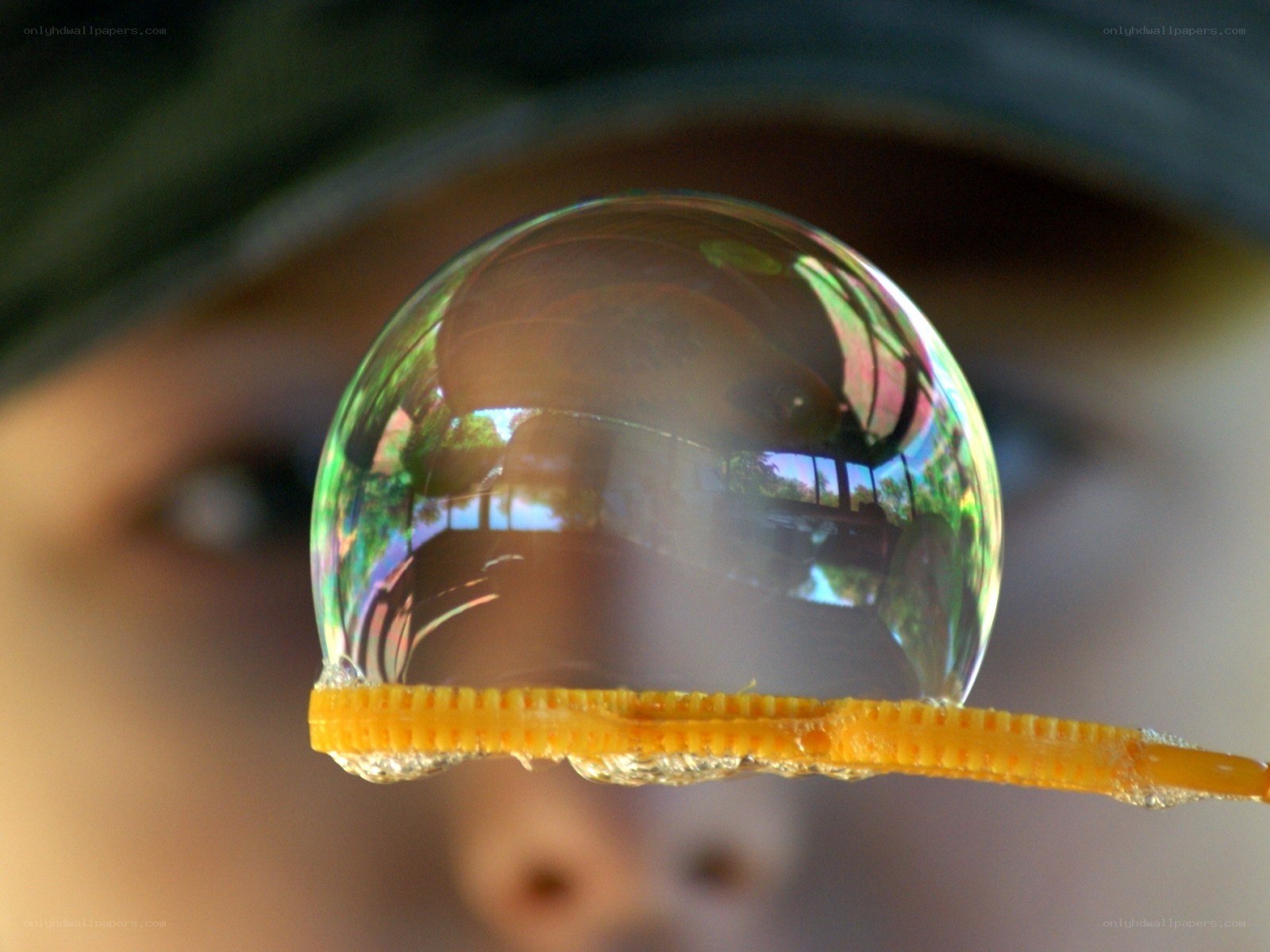 Child blowing a bubble