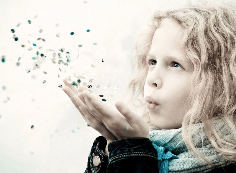 Child Blowing Confetti — White