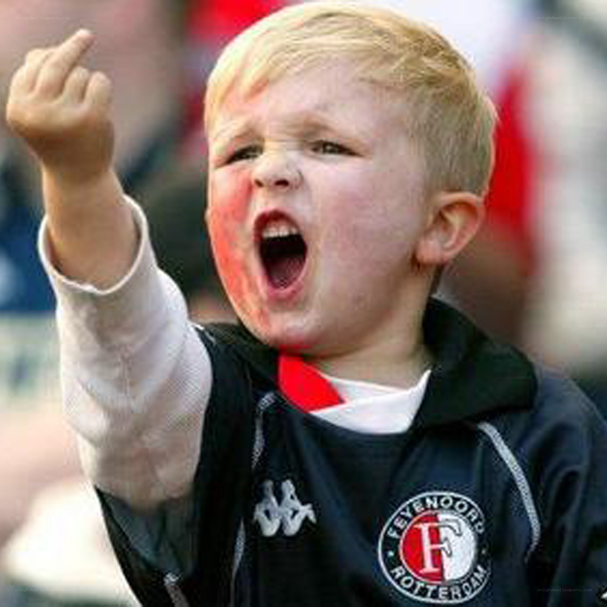 child cheering at a game