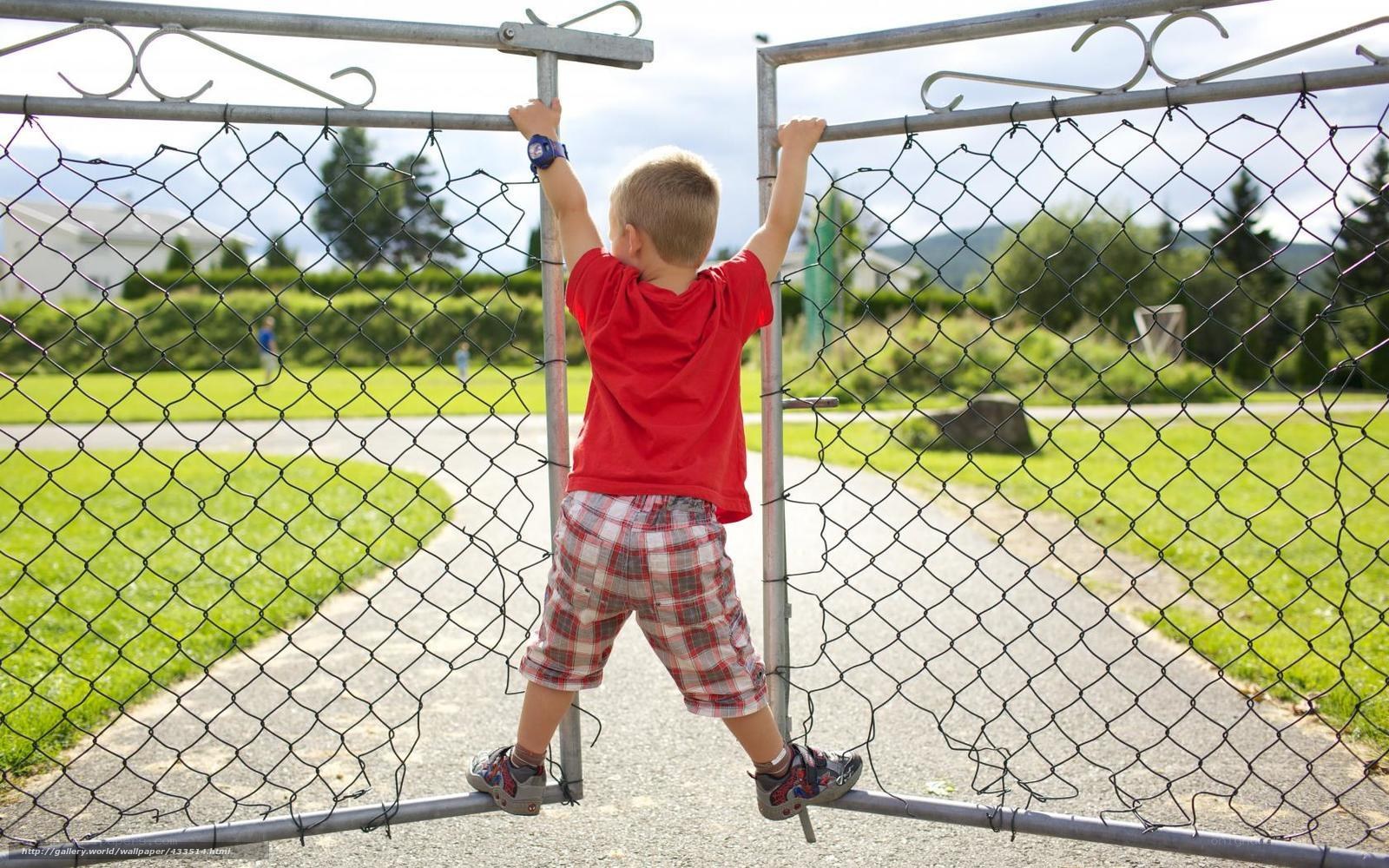 child climbing fence gate