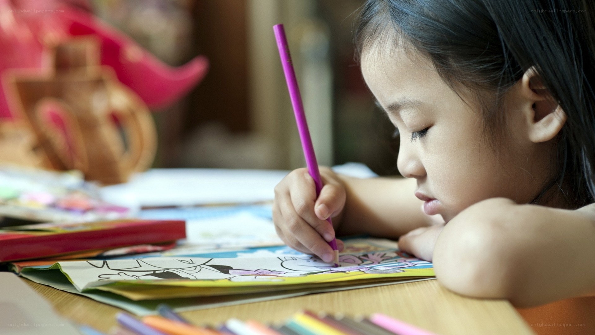 child coloring a book