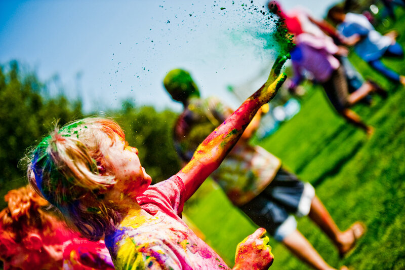 Child Covered in Colored Powder