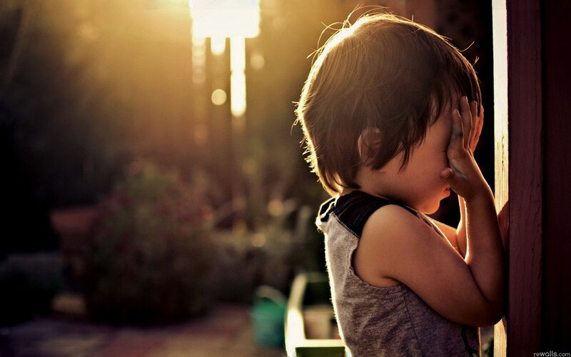 Child Covering Face