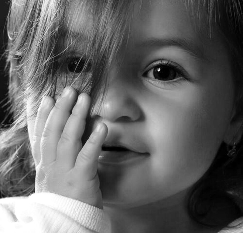 Child Covering Mouth