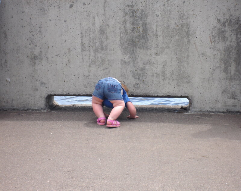 child crawling near water