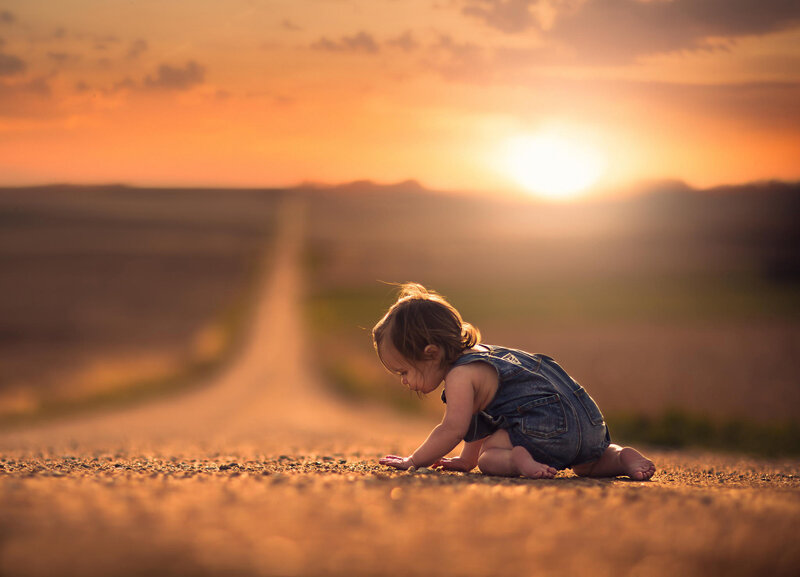 Child Crawling on Road