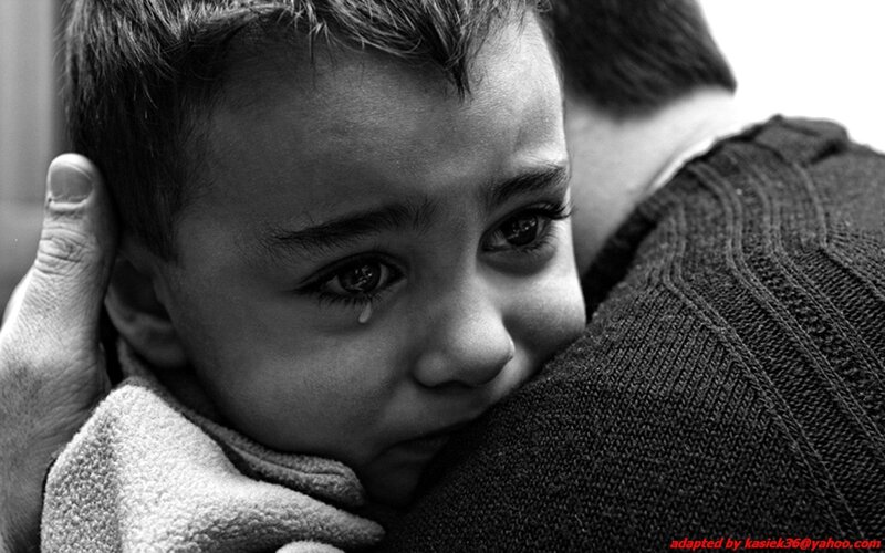 child crying in embrace