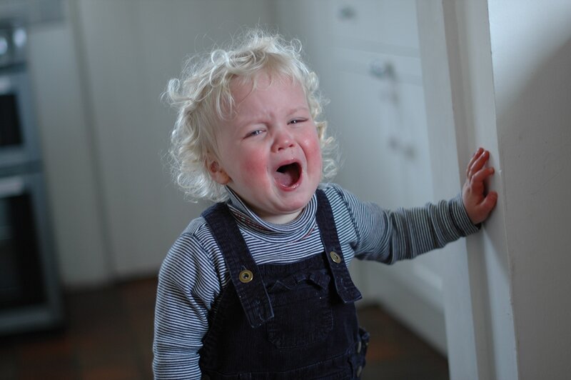 child crying in kitchen