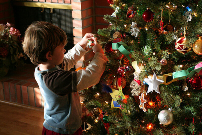 Child Decorating Tree — Green