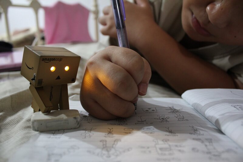 child drawing with danbo robot