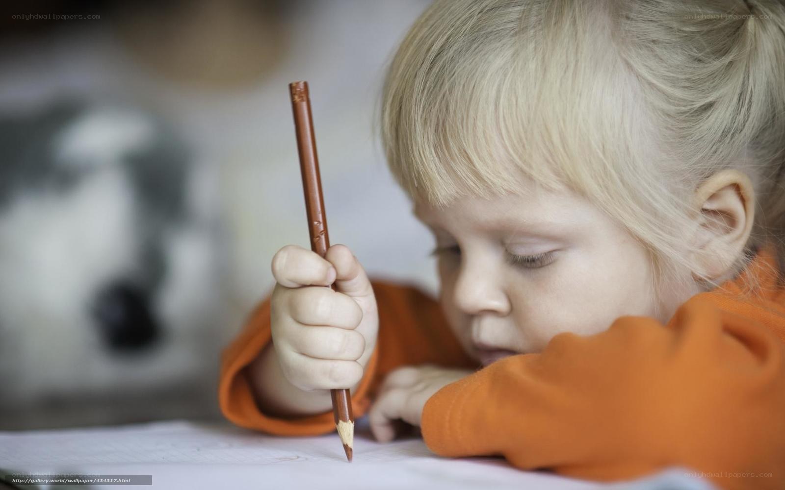 child drawing with pencil