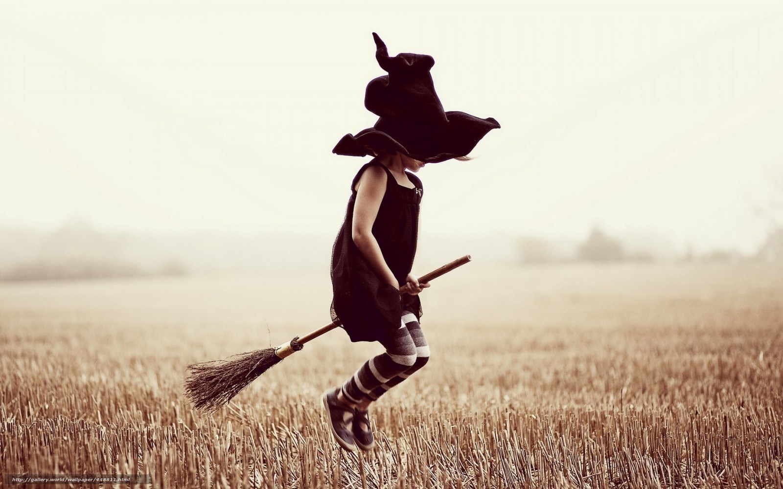 child dressed as a witch