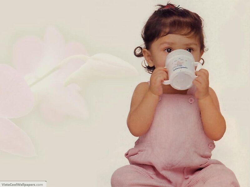 child drinking from a cup
