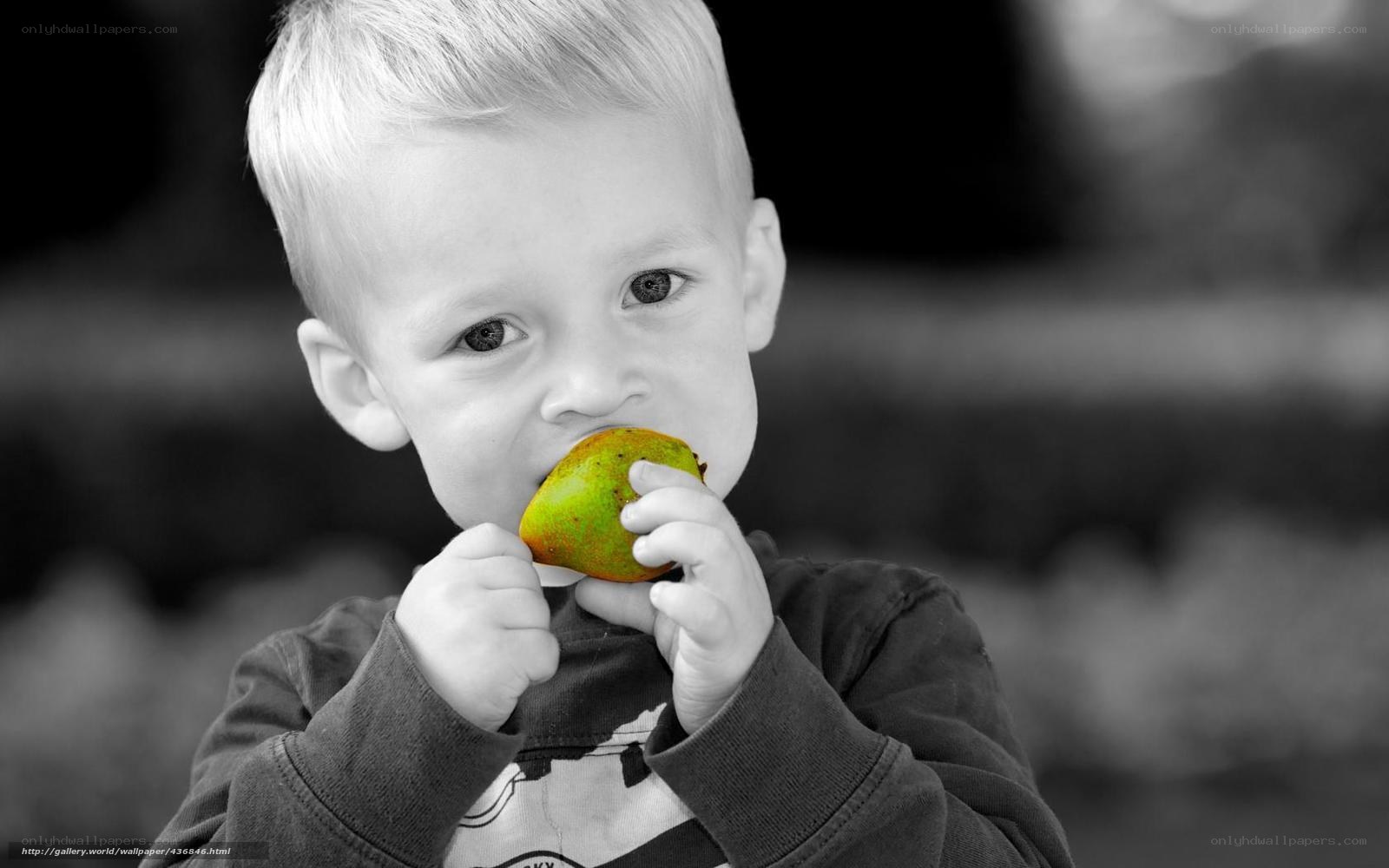 child eating a mango