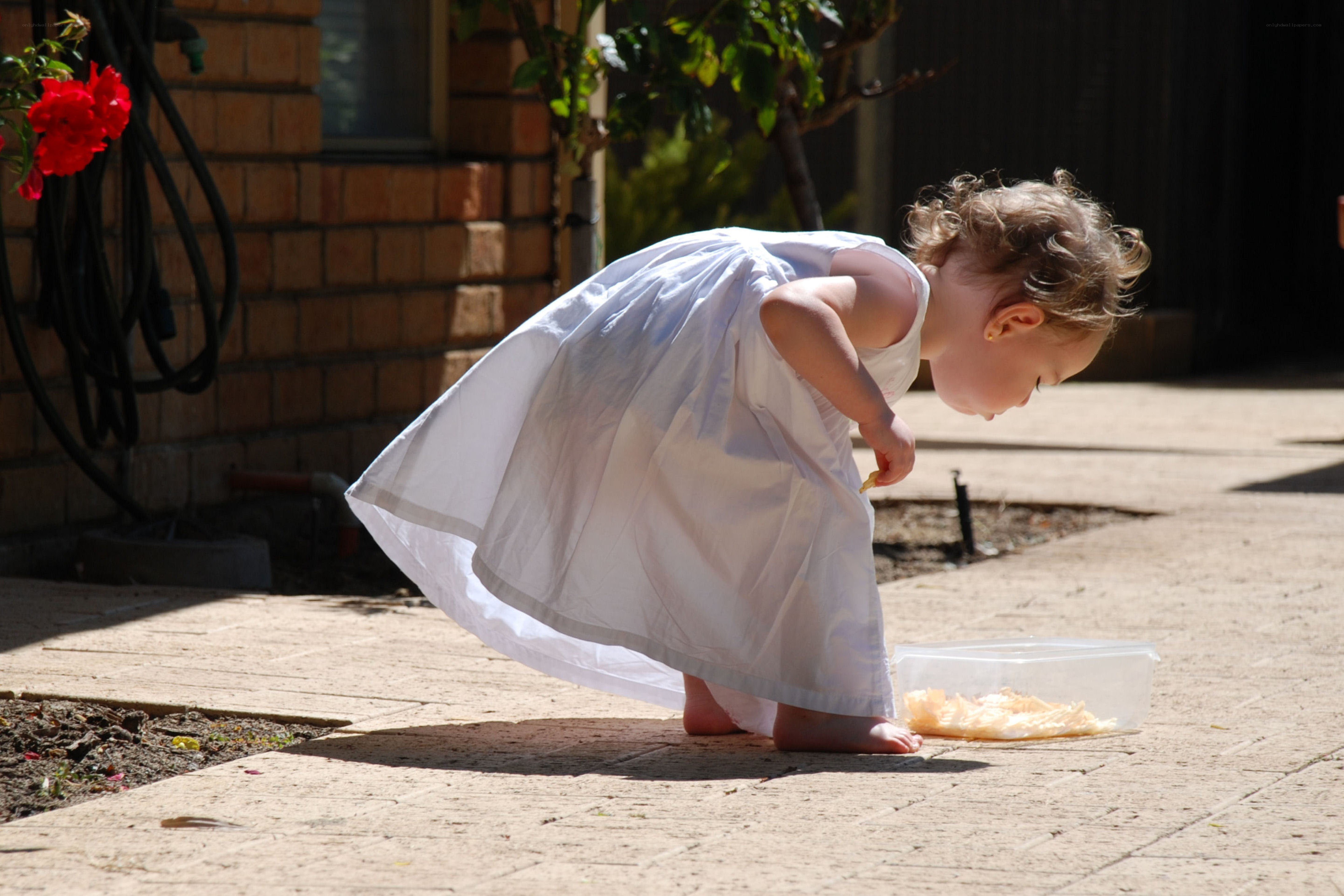 child eating outdoors