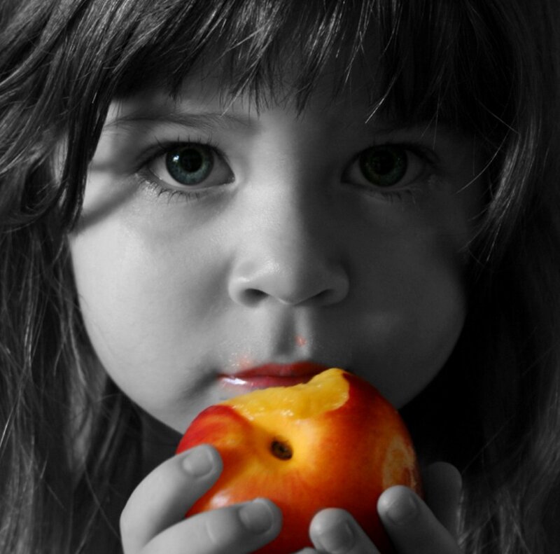 Child Eating Peach