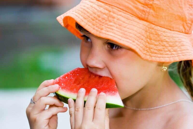 child eating watermelon slice