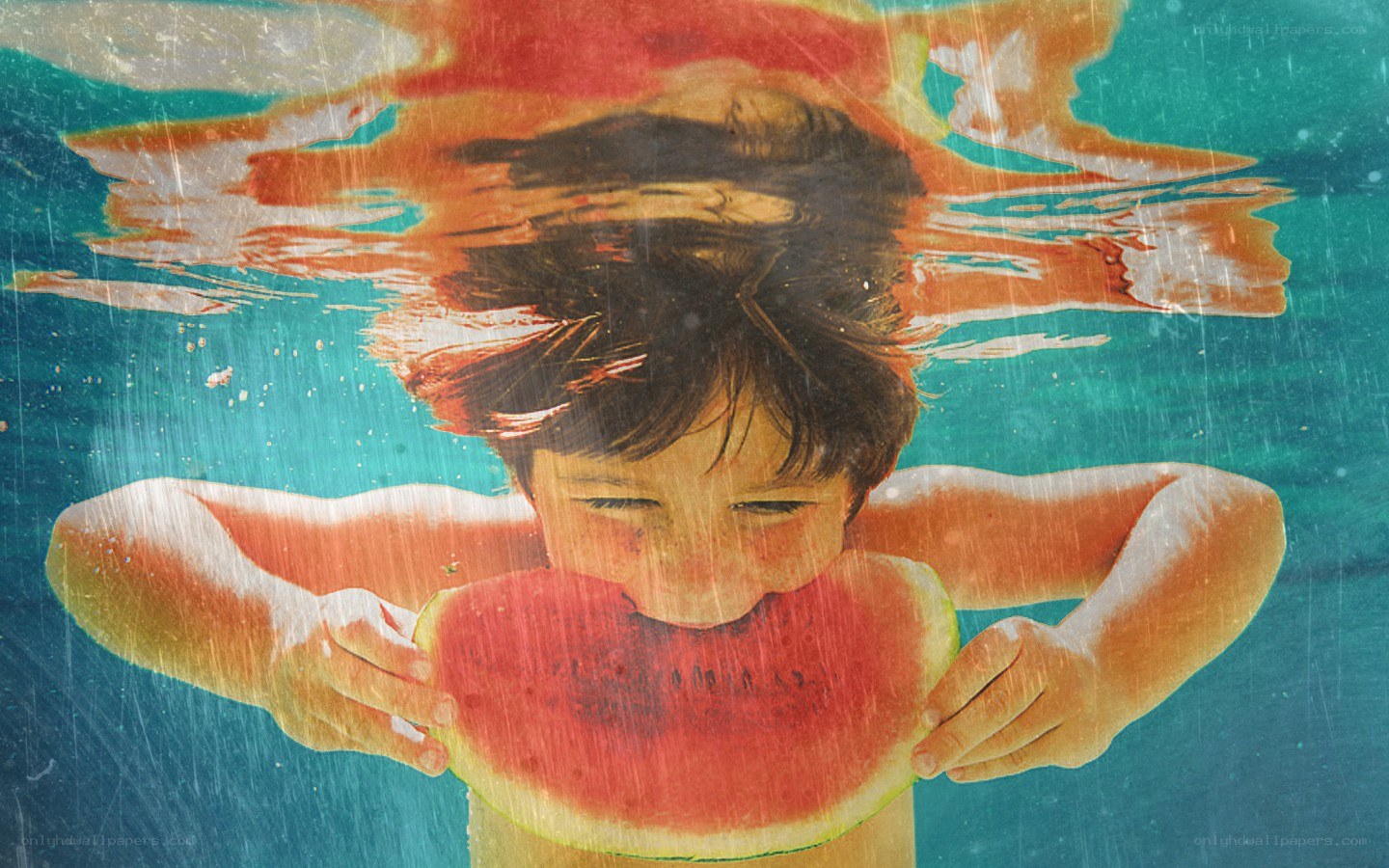 child eating watermelon underwater