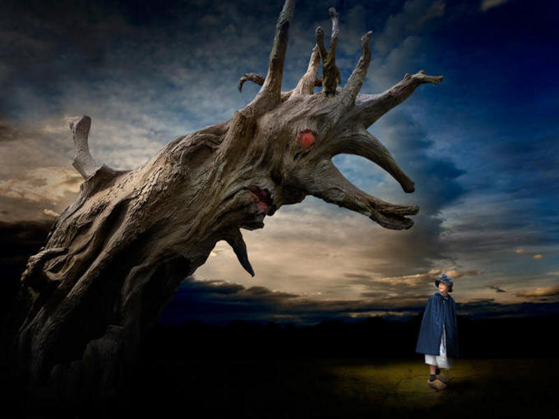 Child facing a monstrous tree