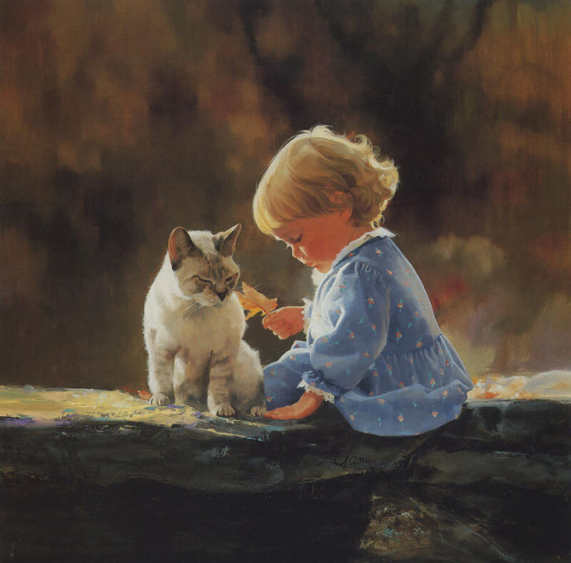 Child Feeding Cat