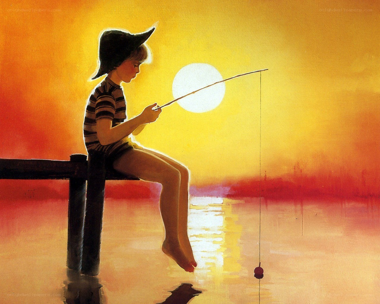 Child fishing at sunset