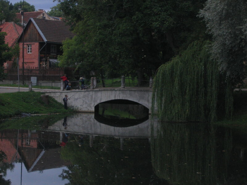Child Fishing by Bridge