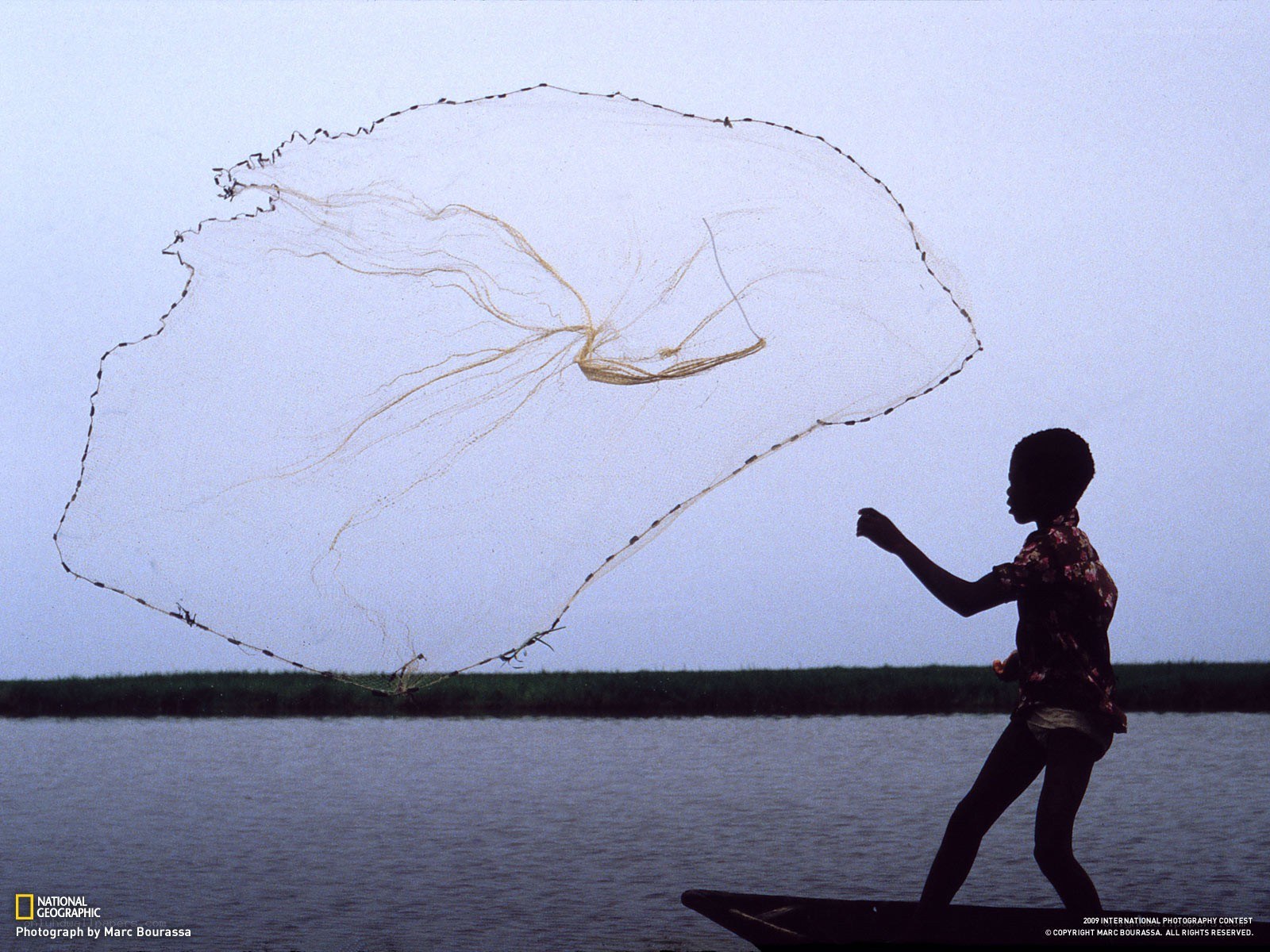 Child fishing with a net