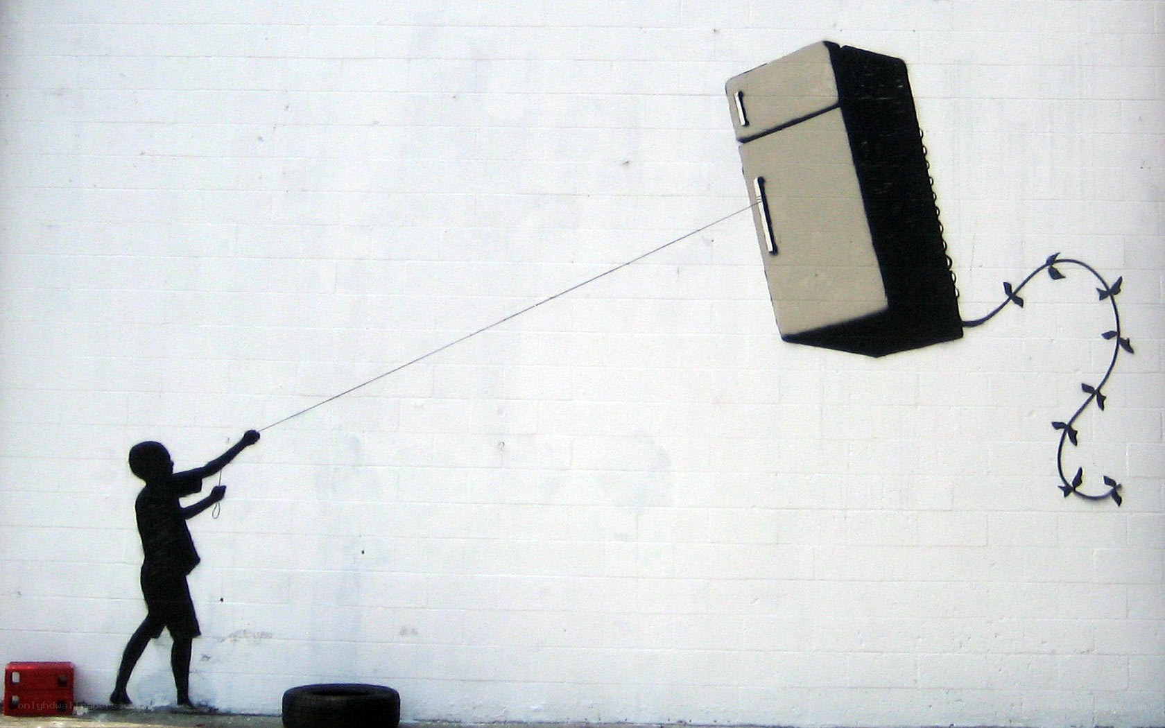 Child flying a refrigerator kite
