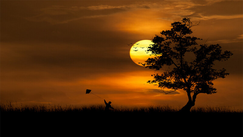 Child Flying Kite — Orange, Serene