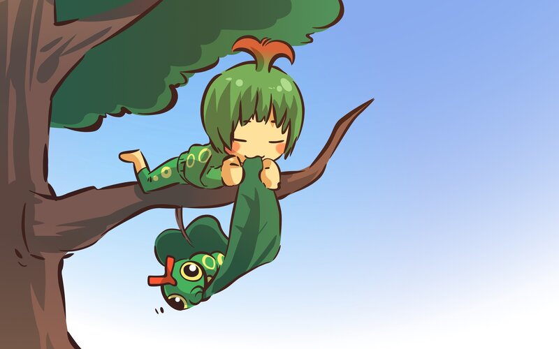child hanging from tree branch