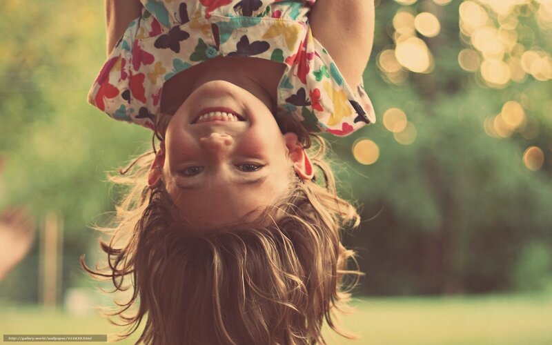 Child Hanging Upside Down — Green, Playful