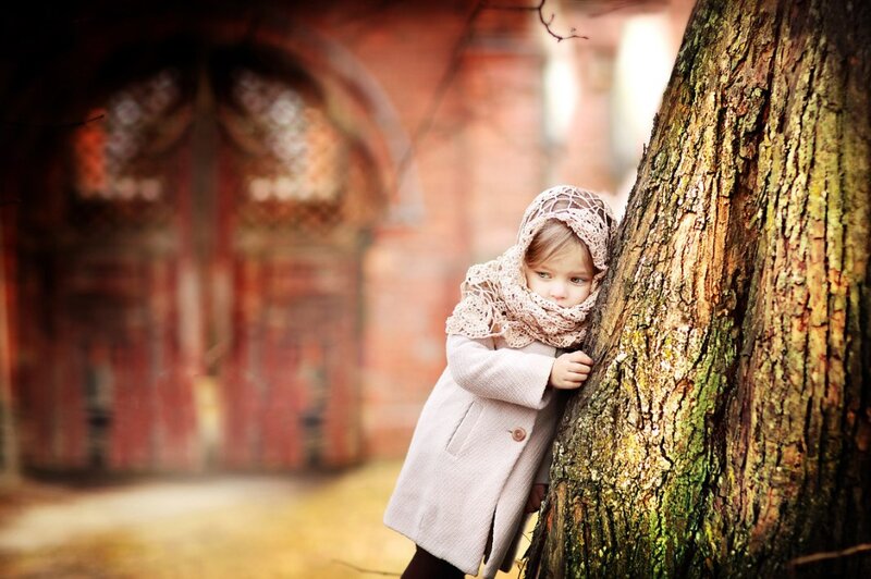 Child Hiding Behind Tree — Brown