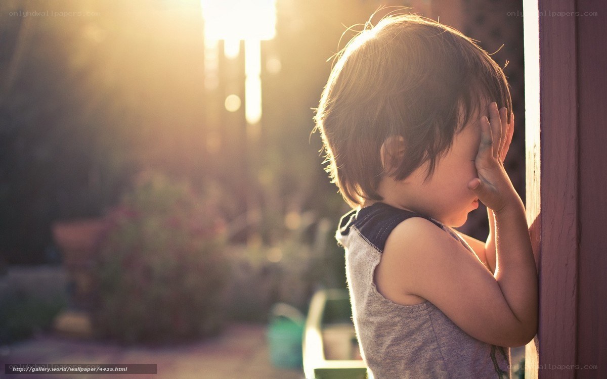 child hiding from sunlight