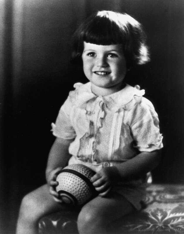 child holding a ball