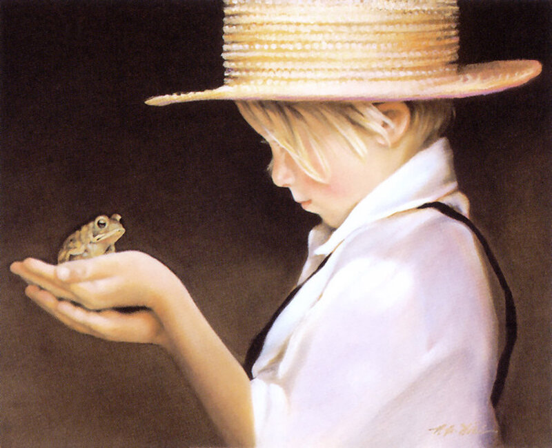 child holding a frog