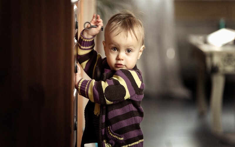 child holding a key