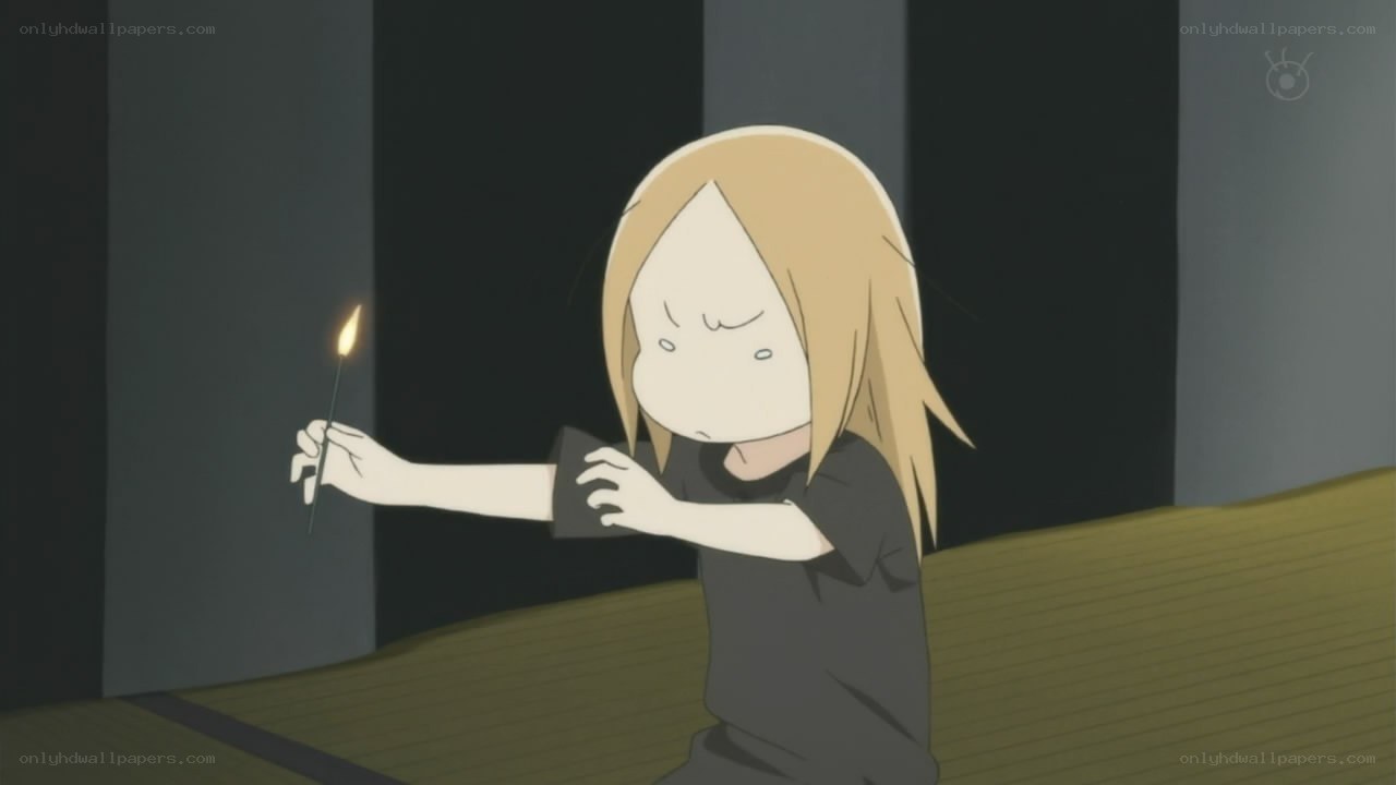child holding a lit match