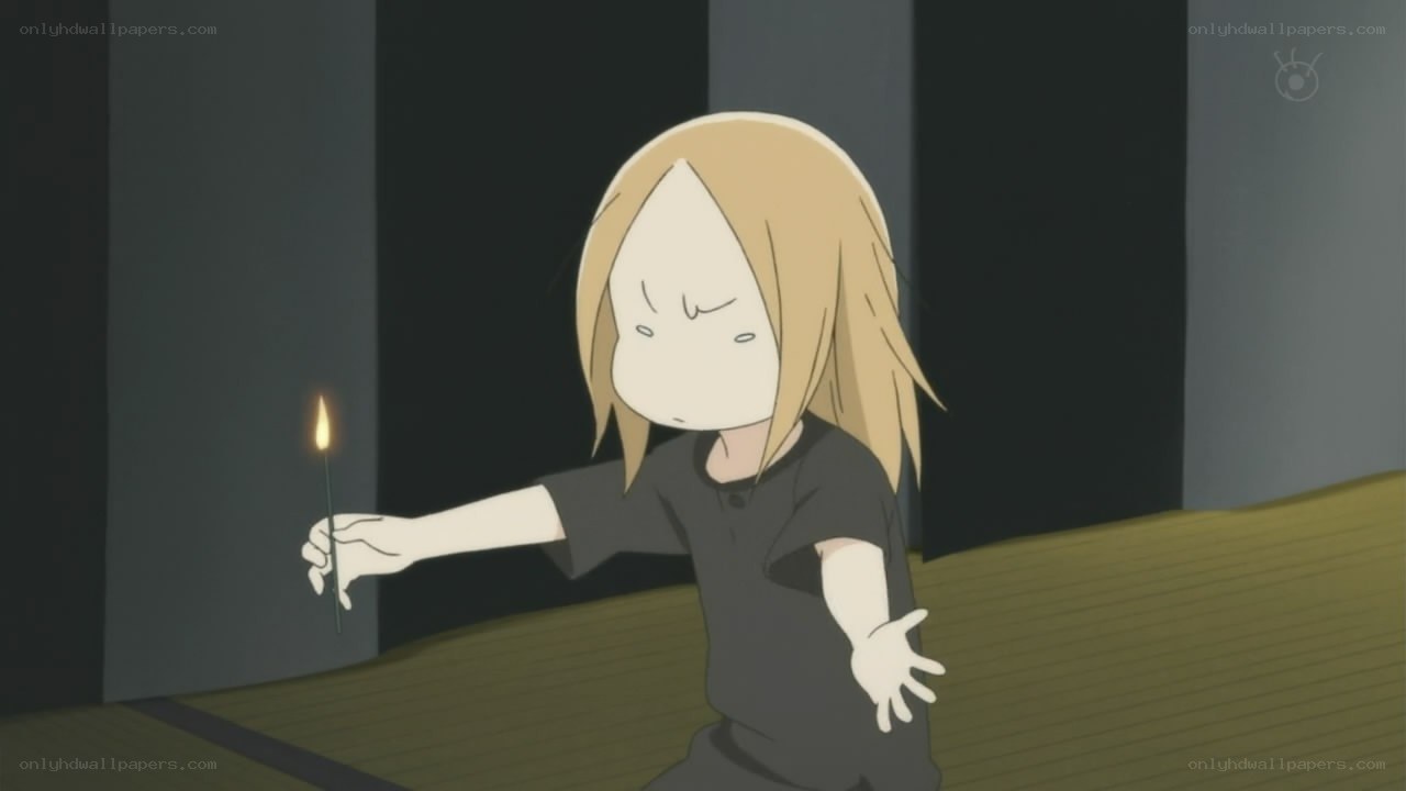 child holding a lit match