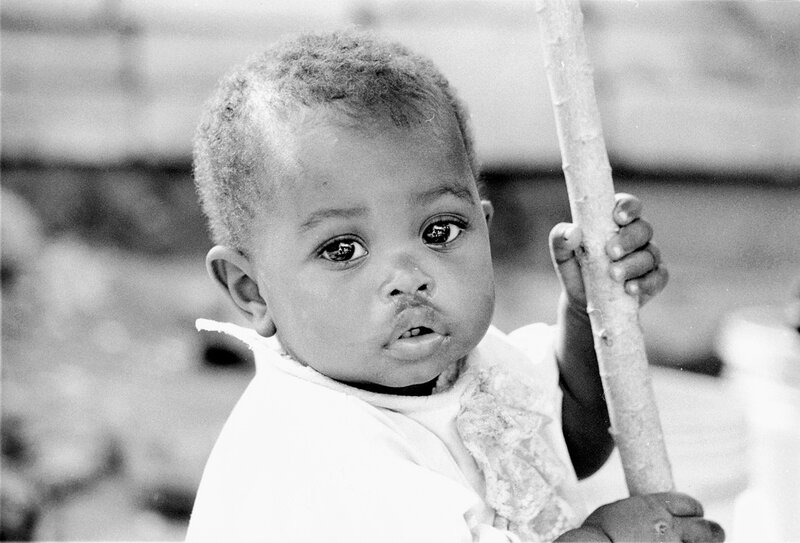 child holding a stick