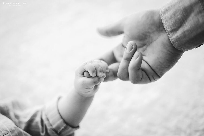 Child Holding Adult Hand — Black