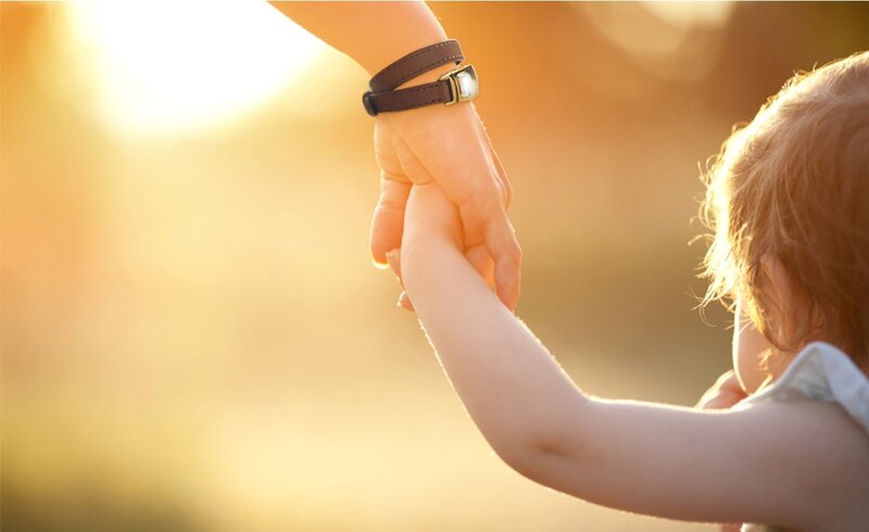 Child Holding Adult Hand — Gold