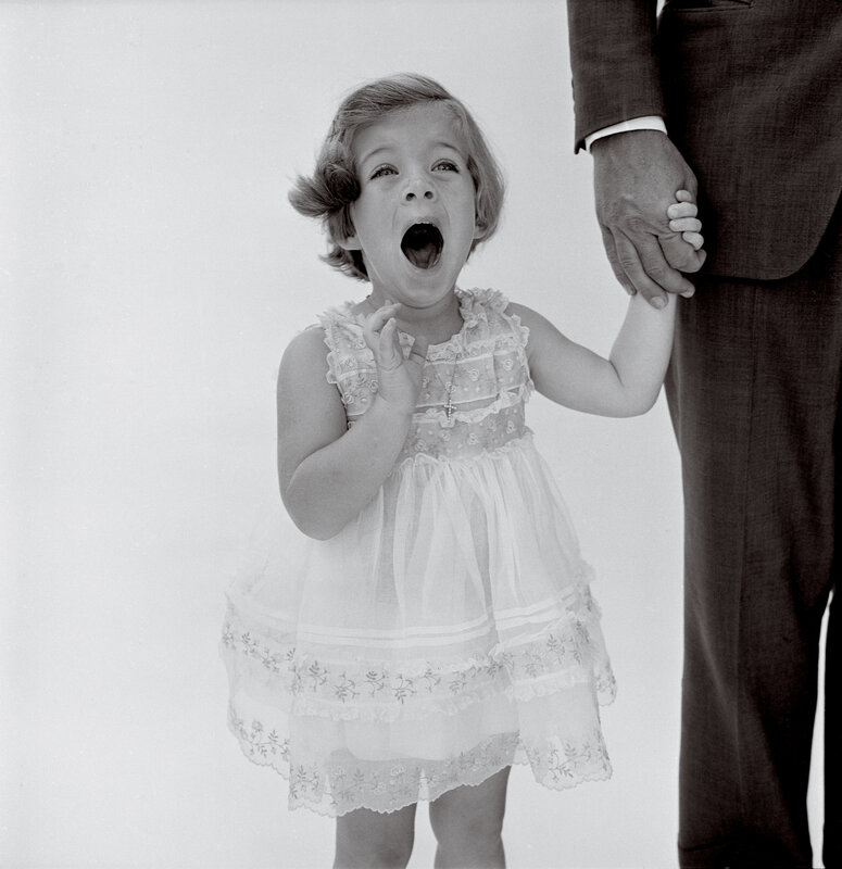 child holding adult's hand