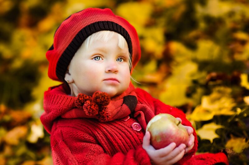 Child Holding Apple — Red