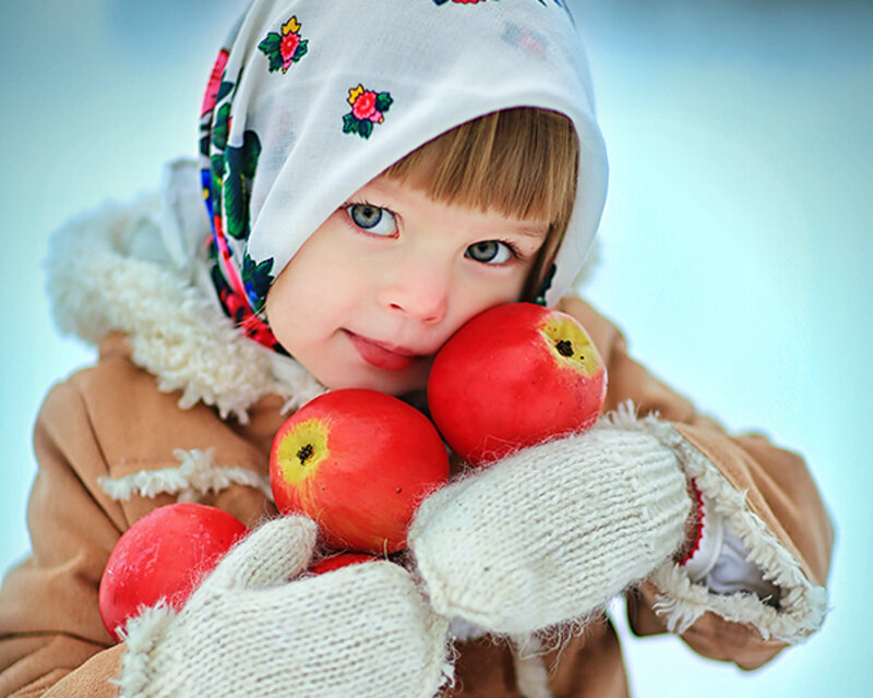 Child Holding Apples