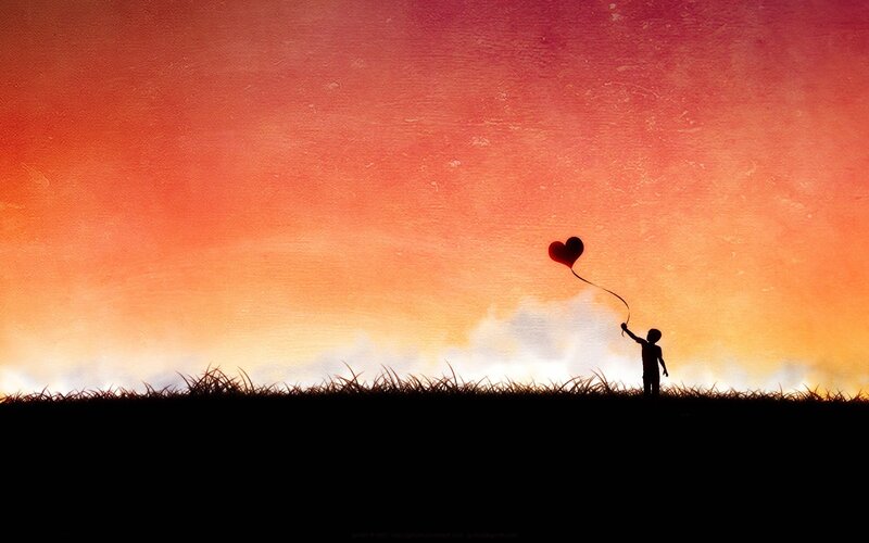 Child Holding Balloon — Orange