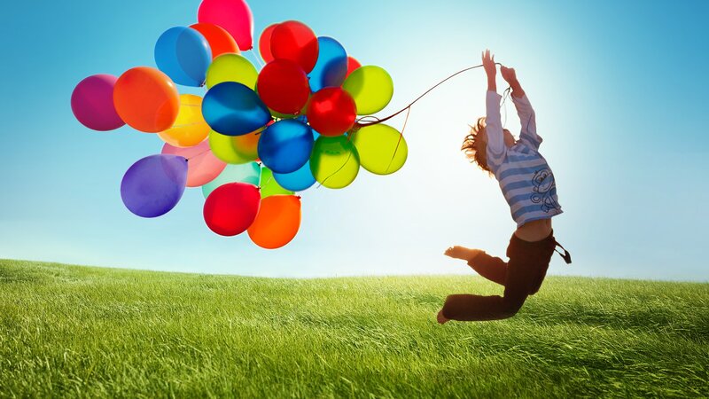 Child Holding Balloons — Green, Joyful, Afternoon