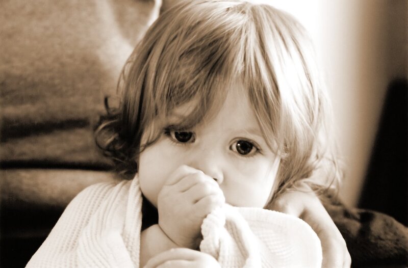 Child Holding Blanket